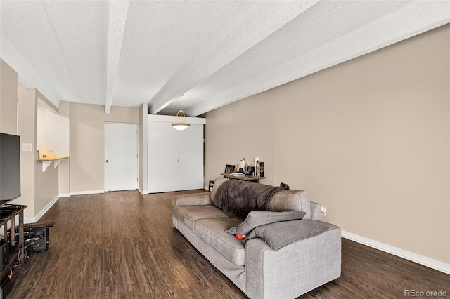 1365 Columbine St Unit 403, Denver, CO 80206 - living room featuring dark wood-style flooring, beam ceiling, and a textured ceiling