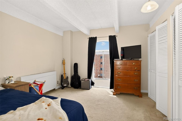 1365 Columbine St Unit 403, Denver, CO 80206 - carpeted bedroom featuring beamed ceiling and a textured ceiling