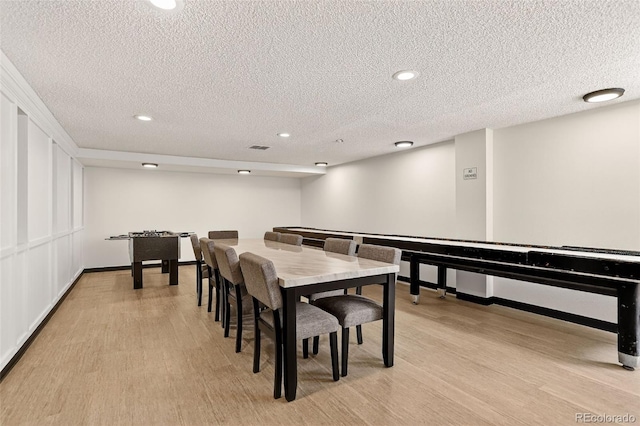 1365 Columbine St Unit 403, Denver, CO 80206 - dining space featuring a textured ceiling, light wood-style floors, and recessed lighting