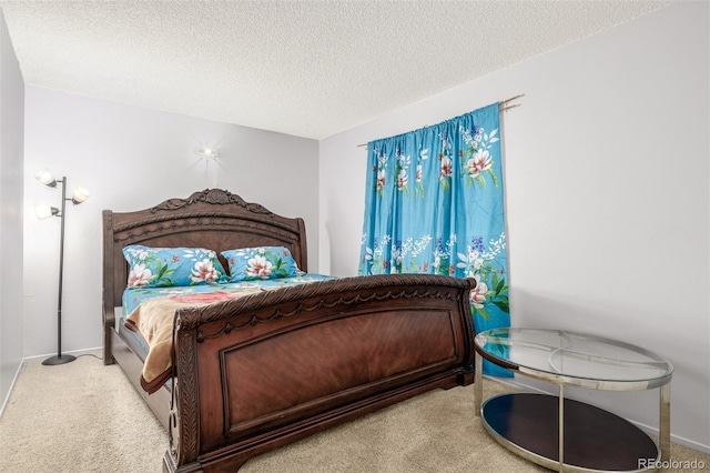 carpeted bedroom featuring a textured ceiling