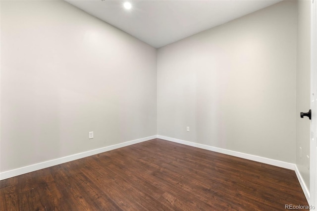 unfurnished room with wood-type flooring