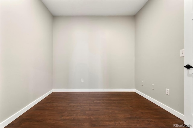 unfurnished room featuring dark hardwood / wood-style flooring