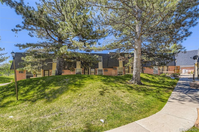 5828 S Pearl St, Centennial, CO 80121 - view of front of home with brick siding, mansard roof, and roof with shingles