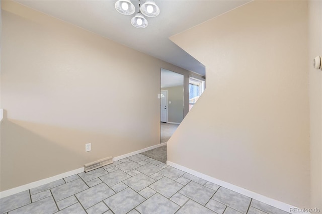 5828 S Pearl St, Centennial, CO 80121 - unfurnished room with a chandelier and light tile patterned floors