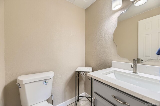 5828 S Pearl St, Centennial, CO 80121 - half bath featuring vanity, tile patterned floors, and a textured wall
