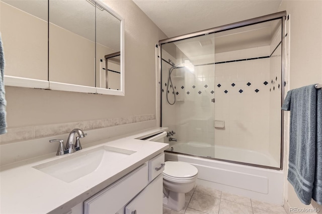 5828 S Pearl St, Centennial, CO 80121 - full bathroom with vanity, shower / bath combination with glass door, and tile patterned floors