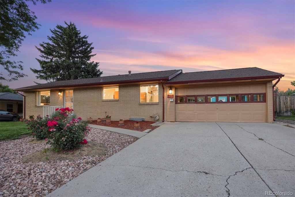 ranch-style house featuring a garage