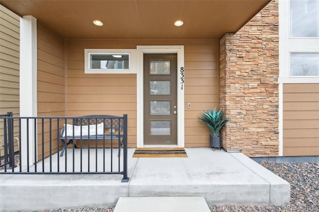 view of exterior entry with stone siding