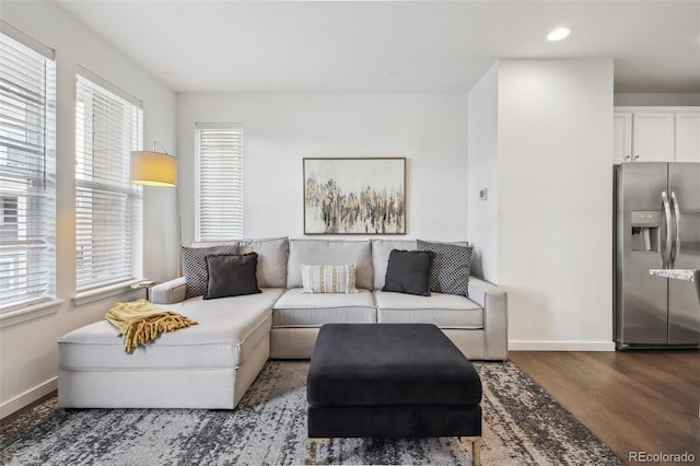 living area featuring recessed lighting, baseboards, and wood finished floors