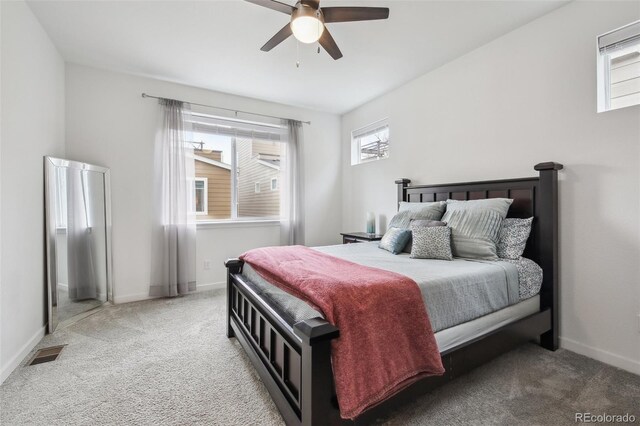 bedroom with baseboards, visible vents, and carpet floors