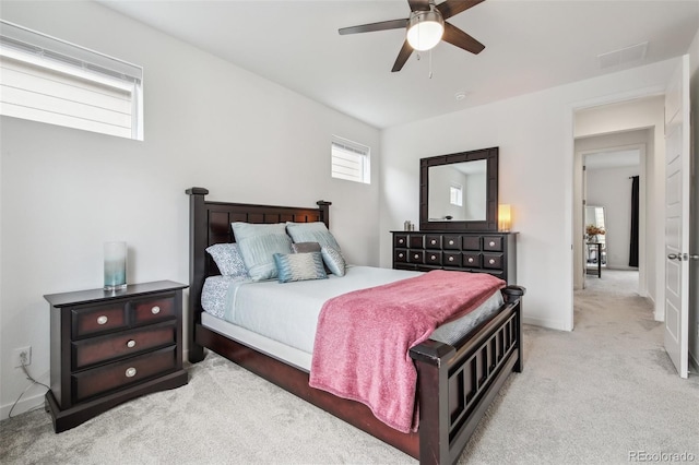 carpeted bedroom featuring a ceiling fan and baseboards