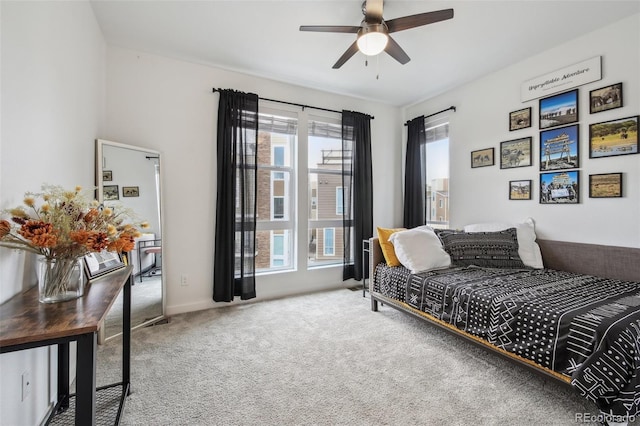 carpeted bedroom with a ceiling fan