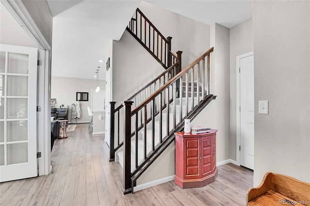 staircase featuring hardwood / wood-style floors