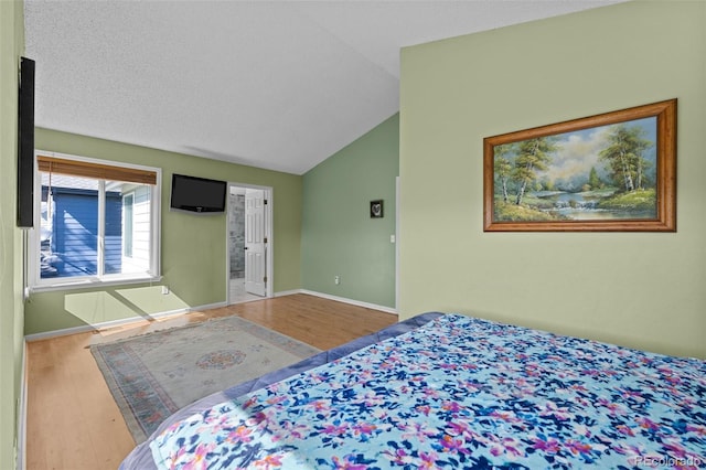10519 Winterflower Way, Parker, CO 80134 - bedroom with lofted ceiling, baseboards, and wood finished floors