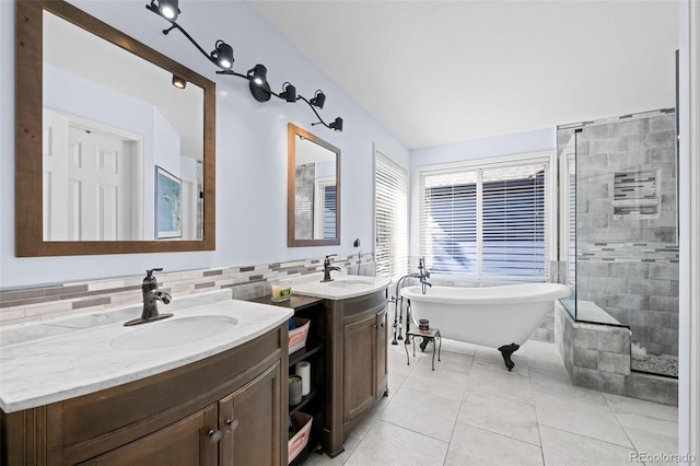 10519 Winterflower Way, Parker, CO 80134 - full bath with a tile shower, a freestanding tub, two vanities, and a sink