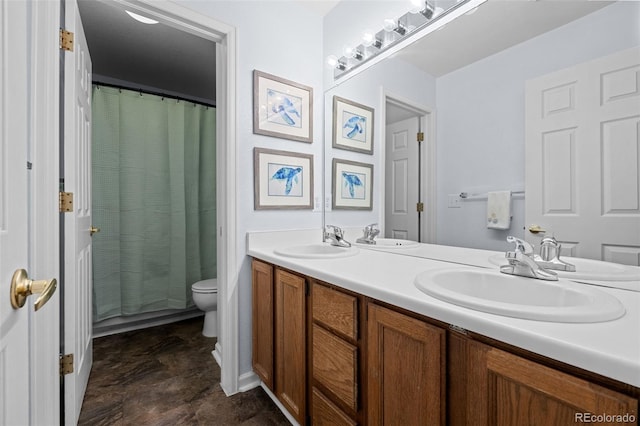 10519 Winterflower Way, Parker, CO 80134 - full bathroom with a sink, double vanity, and toilet