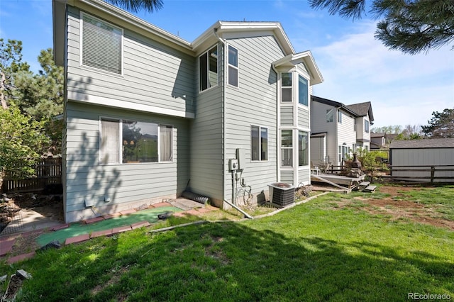 10519 Winterflower Way, Parker, CO 80134 - rear view of property featuring a yard, fence, and central AC