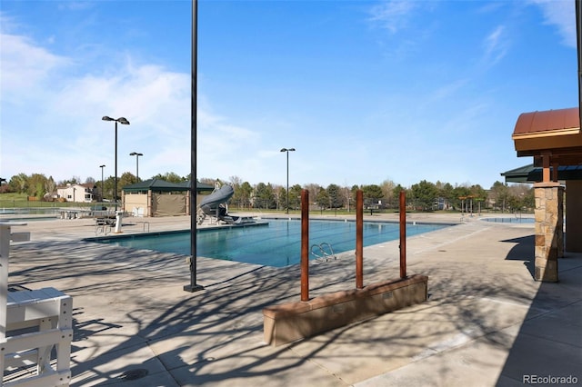 10519 Winterflower Way, Parker, CO 80134 - community pool with a patio area and a water slide
