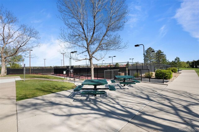10519 Winterflower Way, Parker, CO 80134 - view of property's community with a lawn and fence