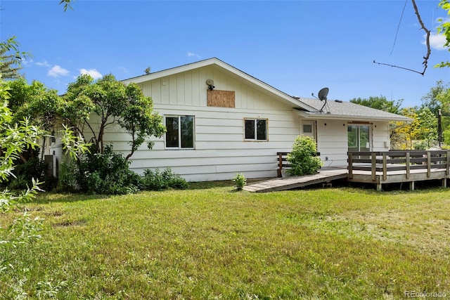 7313 S Boulder Rd, Boulder, CO 80303 - back of property with a wooden deck and a lawn
