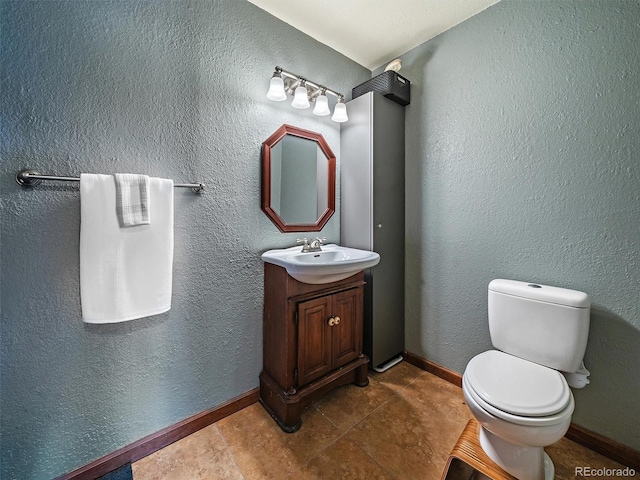 10852 Conifer Mountain Rd, Conifer, CO 80433 - bathroom with toilet, vanity, and baseboards