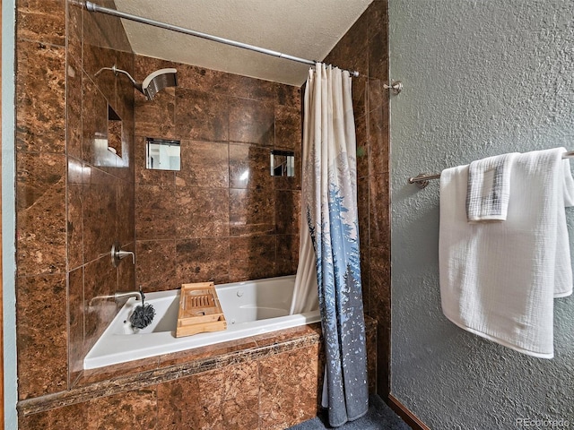 10852 Conifer Mountain Rd, Conifer, CO 80433 - full bathroom with tiled shower / bath, a textured wall, and a textured ceiling