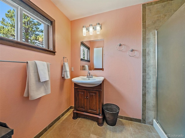 10852 Conifer Mountain Rd, Conifer, CO 80433 - bathroom with a stall shower, plenty of natural light, tile patterned flooring, and vanity