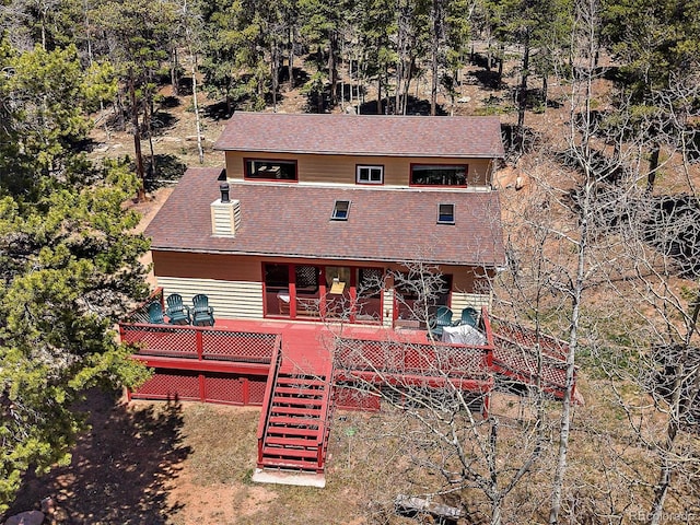 10852 Conifer Mountain Rd, Conifer, CO 80433 - back of property with stairs and roof with shingles