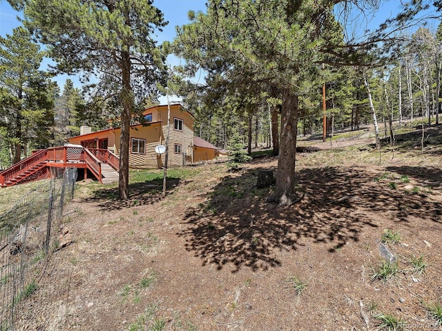 10852 Conifer Mountain Rd, Conifer, CO 80433 - view of yard with stairs and a deck