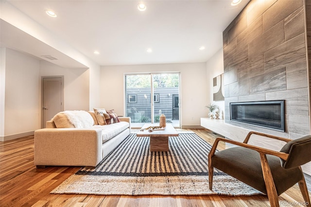 822 Fairfax St, Denver, CO 80220 - living area with wood finished floors, recessed lighting, and a tile fireplace