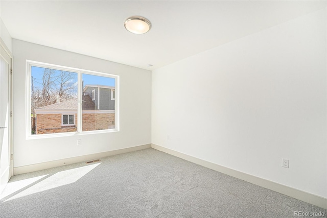 822 Fairfax St, Denver, CO 80220 - empty room featuring carpet floors and baseboards