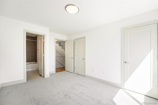 822 Fairfax St, Denver, CO 80220 - unfurnished bedroom featuring carpet floors and ensuite bath