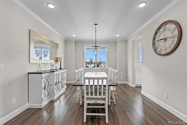 dining space featuring a chandelier, crown molding, and dark hardwood / wood-style floors