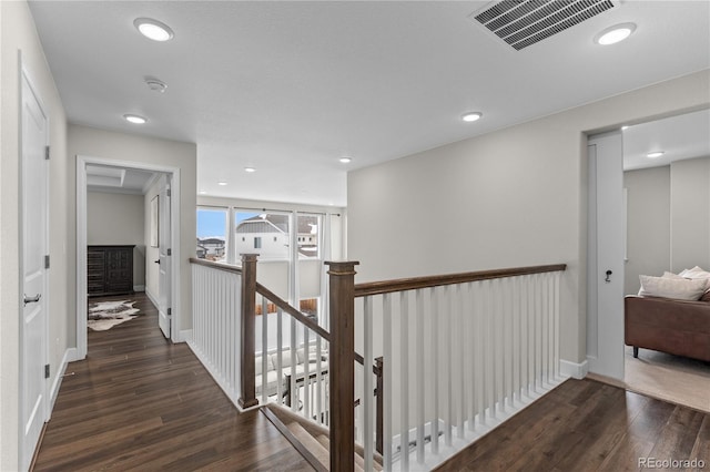 hall with dark hardwood / wood-style flooring