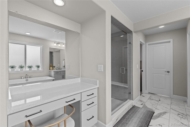 bathroom featuring walk in shower and vanity