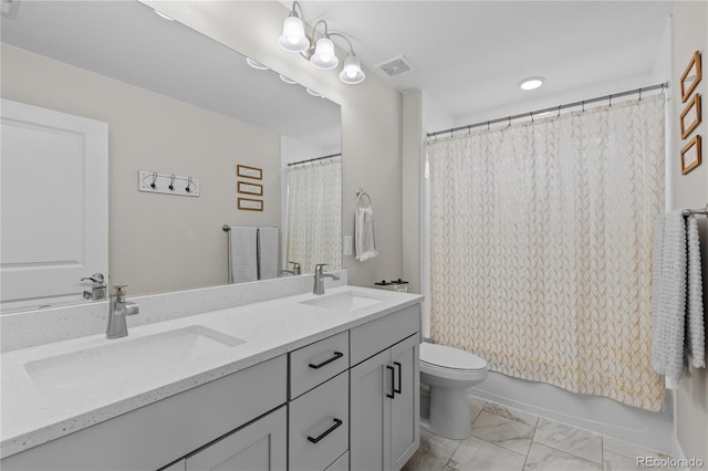 full bathroom with shower / bath combo with shower curtain, toilet, and vanity