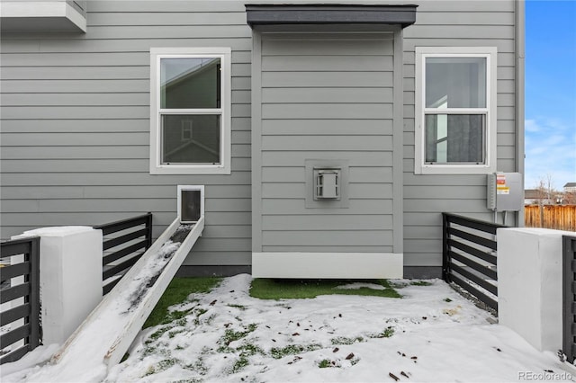 view of snow covered property entrance