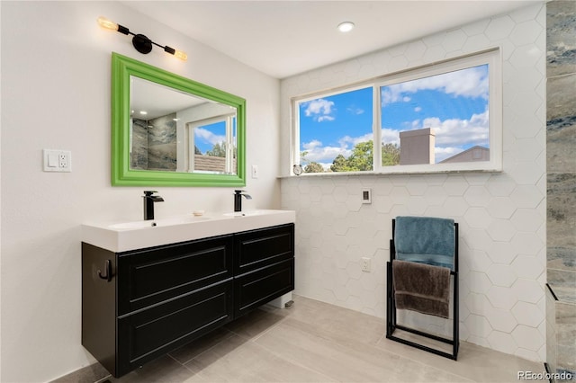 bathroom featuring tile patterned flooring and vanity