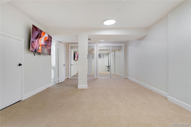 basement with light colored carpet