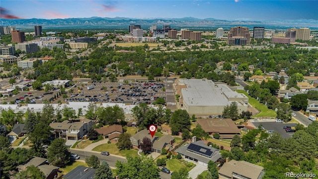 birds eye view of property with a mountain view