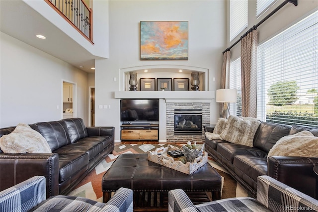 10533 Redcone Way, Highlands Ranch, CO 80130 - living area with a towering ceiling and a glass covered fireplace