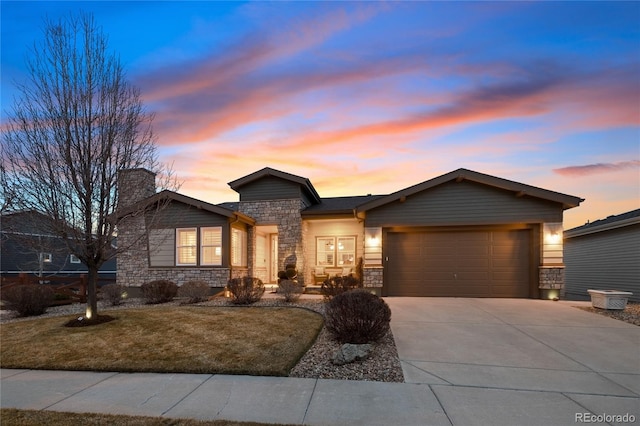 view of front of home with stone siding, a chimney, concrete driveway, and an attached garage