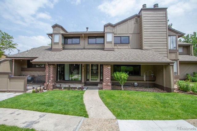 10652 W Florida Ave Unit D, Lakewood, CO 80232 - view of front of house featuring roof with shingles, covered porch, and a chimney