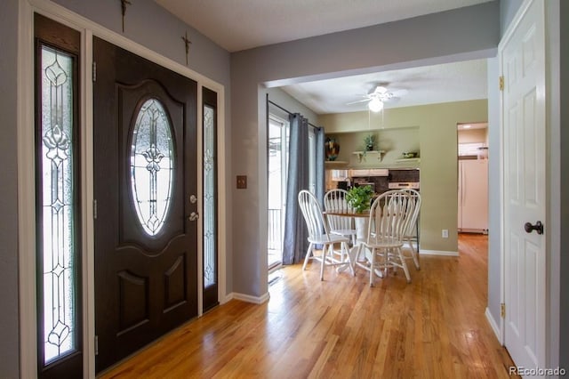 10652 W Florida Ave Unit D, Lakewood, CO 80232 - foyer entrance with plenty of natural light, light wood finished floors, and a ceiling fan