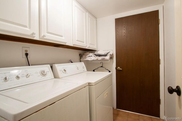 10652 W Florida Ave Unit D, Lakewood, CO 80232 - laundry area with washing machine and dryer, cabinet space, and light tile patterned floors