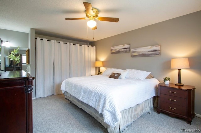 10652 W Florida Ave Unit D, Lakewood, CO 80232 - bedroom with light carpet and ceiling fan