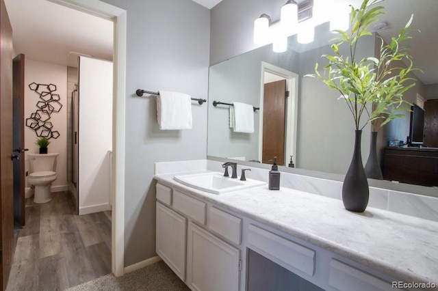 10652 W Florida Ave Unit D, Lakewood, CO 80232 - bathroom with vanity, a stall shower, and wood finished floors