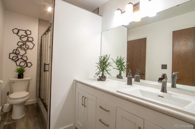 10652 W Florida Ave Unit D, Lakewood, CO 80232 - full bath with wood finished floors, vanity, and a stall shower