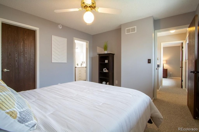 10652 W Florida Ave Unit D, Lakewood, CO 80232 - carpeted bedroom featuring a ceiling fan, ensuite bath, and a closet