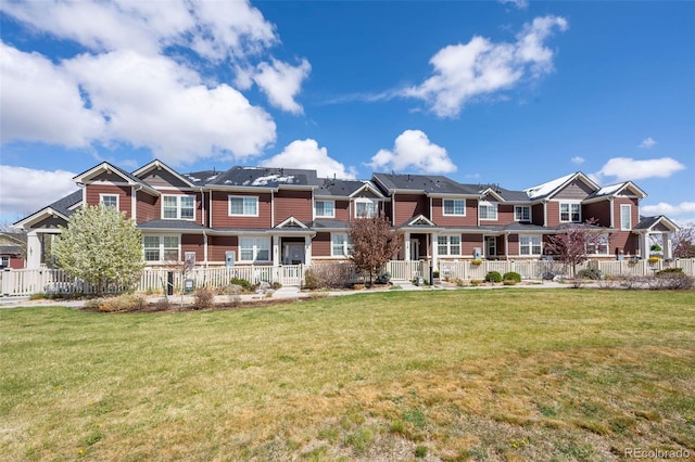 119 Jackson Dr, Erie, CO 80516 - view of front of home featuring a porch, a front yard, and a residential view